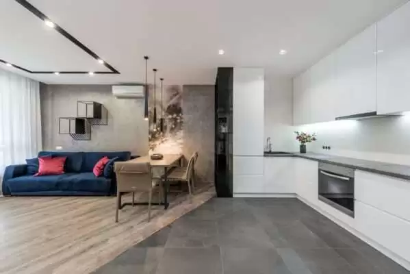 interior of modern apartment with living room and kitchen zone